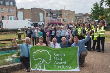 Penny Stocks, front second from left, celebrates Green Flag Award with volunteer & FDC colleagues
